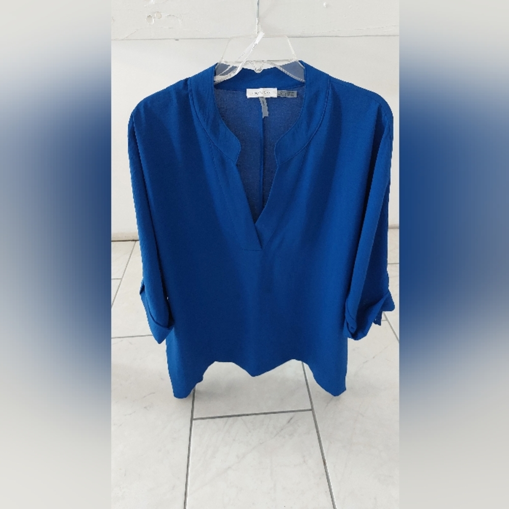 Calvin Klein, blue and pink women's shirts.  Slightly used, excellent condition.